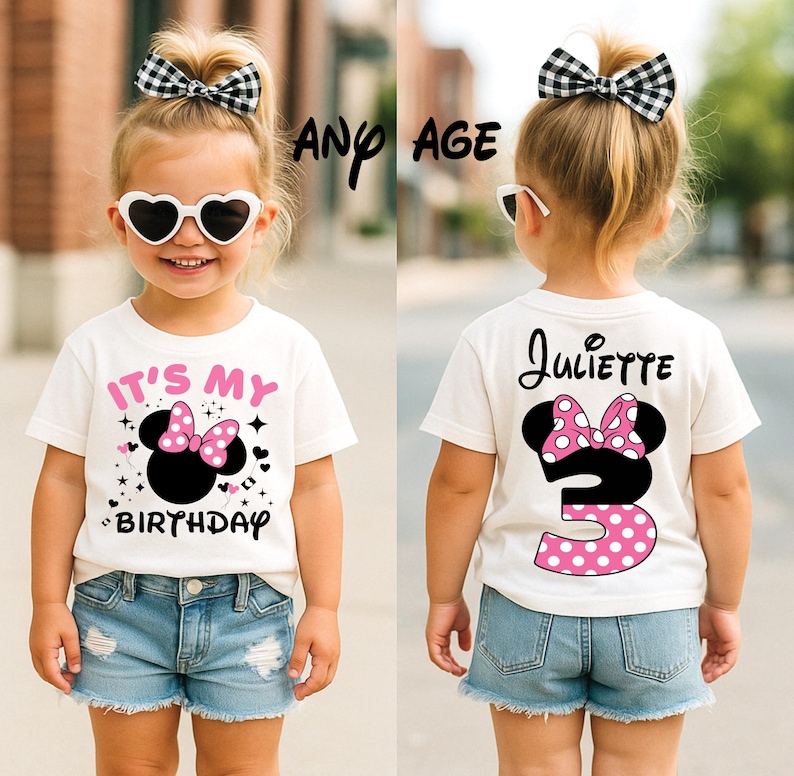 May include: A young child wearing a white t-shirt with a Minnie Mouse design and the text "IT'S MY BIRTHDAY". The back of the shirt has the name "Juliette" and the number "3". The child is also wearing denim shorts and heart-shaped sunglasses.