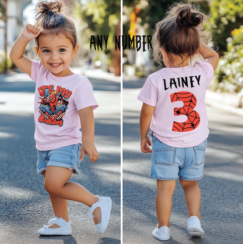 May include: A child in a light pink t-shirt and denim shorts. The front of the shirt displays a Spider-Man graphic and the text "It's My Birthday". The back of the shirt has the name "Lainey" and the number "3" with a spiderweb design.