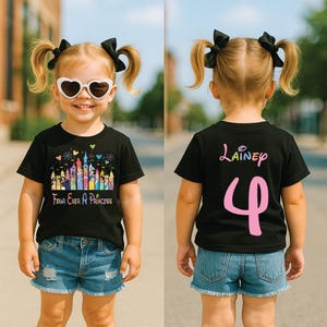 May include: A black t-shirt with a colorful castle graphic and the text "Four Ever A Princess" on the front. The back of the shirt has the name "Lainey" and the number "4" in pink.