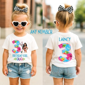 May include: A white t-shirt with a large number 3, floral design, and the text "BIRTHDAY GIRL" and "LAINEY". The shirt features a cartoon image of Moana. The girl is wearing denim shorts and heart-shaped sunglasses.