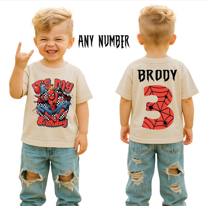 May include: A beige t-shirt featuring a Spider-Man graphic and the text "It's My Birthday" on the front. The back of the shirt displays the name "Brody" and the number "3" with a spiderweb design. The shirt is worn by a child.