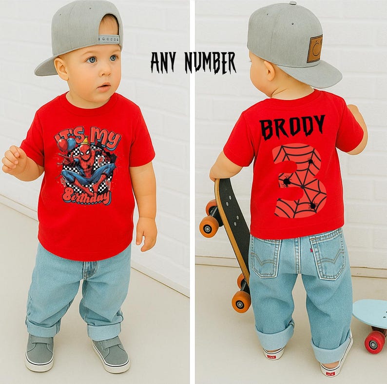 May include: A toddler in a red t-shirt featuring a Spider-Man design and the words "It's My Birthday". The child wears light blue jeans and a grey baseball cap. The back of the shirt says "Broddy" and the number "3".