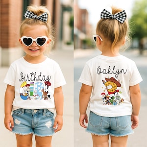 K&ouml;nnte beinhalten: Ein Kind tr&auml;gt ein wei&szlig;es T-Shirt mit der Aufschrift "Birthday Girl" und einem Cartoon-Motiv. Das Kind tr&auml;gt auch Jeansshorts, herzf&ouml;rmige Sonnenbrillen und eine schwarz-wei&szlig; karierte Schleife.