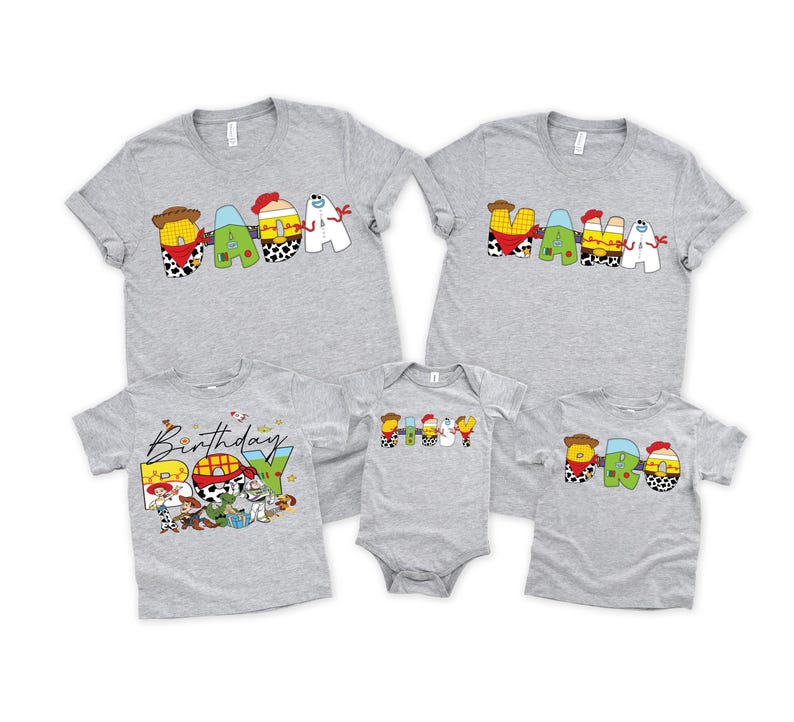 May include: A collection of gray t-shirts and a onesie featuring colorful cartoon character designs. The shirts spell out "MAMA", "DADA", and "BRO", with a "Birthday" design. The onesie and shirts are short-sleeved.