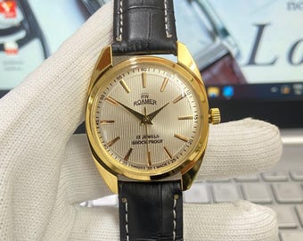 Montre mécanique Roamer vintage, 17 rubis, bracelet en cuir noir