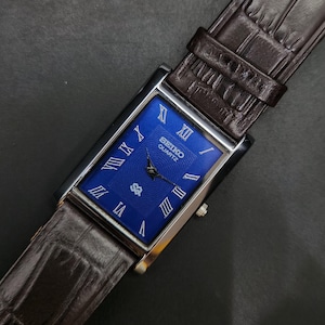 Vintage Refurbished Seiko Slim Quartz Blue Face Brown Band 26mm Rectangular Men's Watch