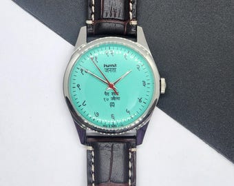 Reloj vintage HMT Janata de cuerda manual: esfera verde, fondo de exhibición