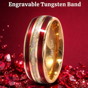 May include: A gold-colored tungsten band with red enamel stripes and a central opal-like inlay. The ring has the text "Ever After" engraved on the side. The words "Engravable Tungsten Band" are at the top.