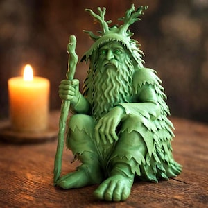 May include: A white ceramic mug with a black handle and the text "But First, Coffee" in a black, handwritten-style font. The mug is on a white surface.