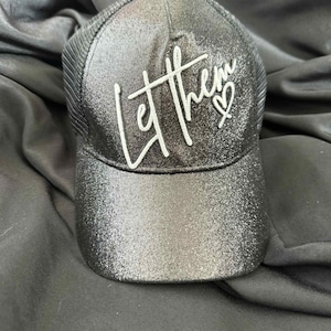 Let Them Black Metallic Trucker Hat