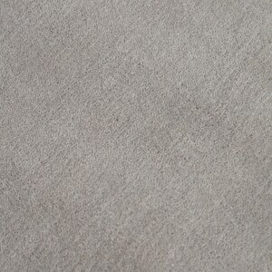 May include: Close-up of a light gray, textured fabric. The surface has a slightly uneven appearance, with a subtle, speckled pattern. The fabric appears soft and could be used for upholstery or clothing.