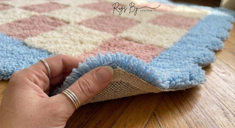Folded rug corner showing construction, backing, and handcrafted quality.