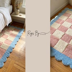 Handmade checkerboard rug photographed in natural sunlight with soft pastel colors.