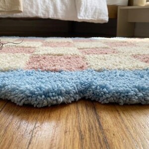 Low-angle view highlighting the thickness and pile height of the tufted rug.