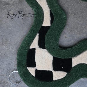 Upper Rug Details of Green Checkerboard Hand Tufted Mirror, showing metal hanging hooks
