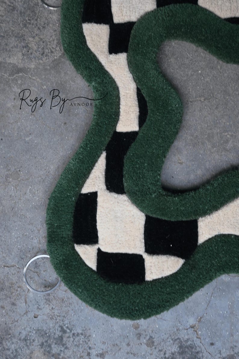 Upper Rug Details of Green Checkerboard Hand Tufted Mirror, showing metal hanging hooks
