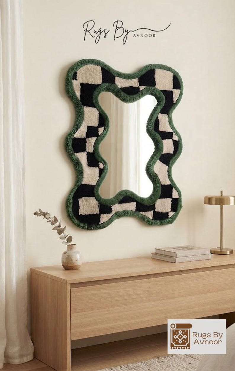 Modern interior featuring a black and cream checkerboard tufted mirror as a statement wall decor piece.