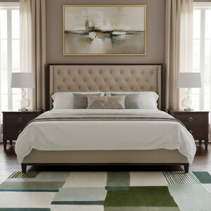 May include: A bedroom scene featuring a tufted headboard bed with white bedding and decorative pillows. Two dark brown nightstands flank the bed, each with a lamp. A large abstract painting hangs above the bed, and a patterned rug covers the floor.