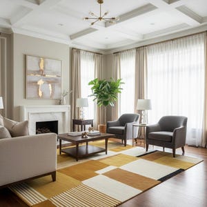 May include: A modern living room featuring a geometric patterned rug in shades of gold, brown, and white. The room includes a sofa, two gray armchairs, a coffee table, and a fireplace. The text "LUXE RUGS" is visible at the bottom.