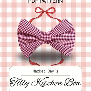 May include: A red and white gingham Tilly Kitchen Bow PDF pattern. The bow is a large, decorative kitchen accessory with a red ribbon. The background is a pink and white checkered pattern. Text on the image reads "PDF Pattern" and "Market Day's Tilly Kitchen Bow".