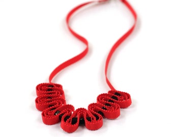 Red ribbon necklace with black beads