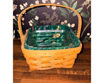 Cesta Longaberger 1994 tejida a mano con forro floral y protector de plástico (tamaño pequeño)