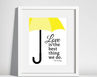 May include: A white framed print with a yellow umbrella and a quote that reads "Love is the best thing we do. - Ted Mosby"