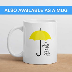 May include: White ceramic mug with a yellow umbrella and the quote "Love is the best thing we do. -The Masky" printed on it.