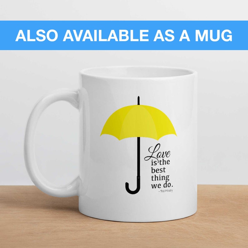 May include: White ceramic mug with a yellow umbrella and the quote "Love is the best thing we do. -The Masky" printed on it.