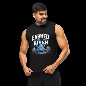 May include: A black sleeveless shirt featuring a graphic of a blue water droplet character lifting a barbell. The text above the character reads EARNED NOT GIVEN in white block letters. The design includes blue accents and a distressed texture.