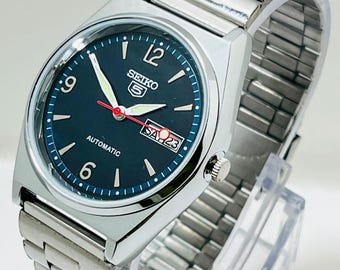 Montre vintage Seiko5 automatique 6349 ronde d'occasion : cadran bleu, acier inoxydable, 21 rubis japonais