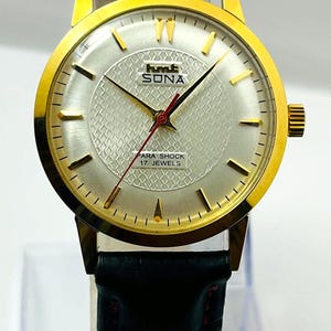 Orologio meccanico vintage HMT Sona: cassa dorata, quadrante bianco, 17 rubini.