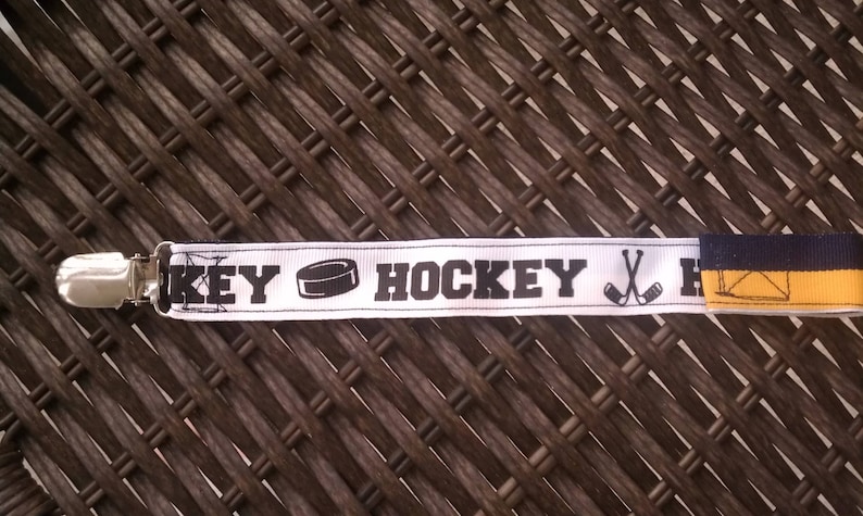 Hockey pacifier clip-navy and gold