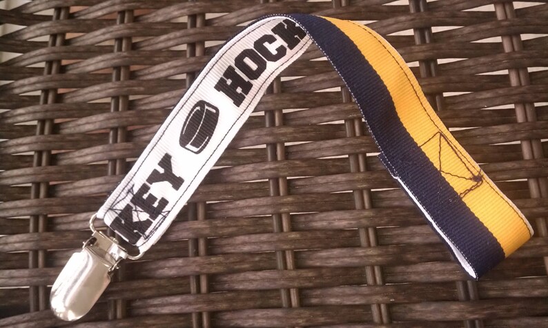 Hockey pacifier clip-navy and gold