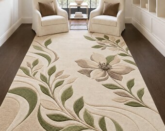 May include: A rectangular area rug featuring a cream-colored background with a raised, carved floral pattern. The design includes large, multi-petaled flowers and flowing vine motifs in shades of sage green, olive, and soft taupe throughout.