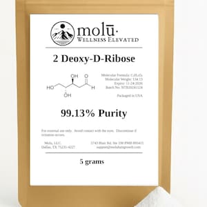 May include: A tan pouch with a white label featuring the text "molu. WELLNESS ELEVATED" and "2 Deoxy-D-Ribose". The label includes a chemical structure, purity percentage, and product information. A small pile of white powder is visible.