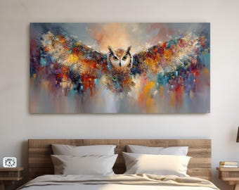 May include: An abstract painting of an owl with outstretched wings, in a bedroom setting. The artwork uses a vibrant palette of colours, including orange, yellow, and red, with blue and green accents. The painting is above a wooden bed, with a view of a snowy mountain.
