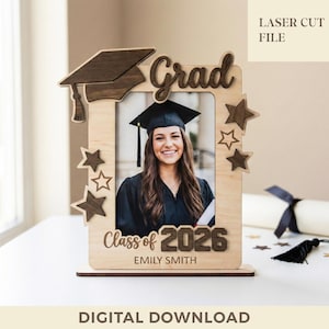 May include: Wooden graduation photo frame with the word "Grad" and a mortarboard design. The frame includes the text "Class of 2026" and a name. The frame is decorated with star accents and holds a graduation photo.
