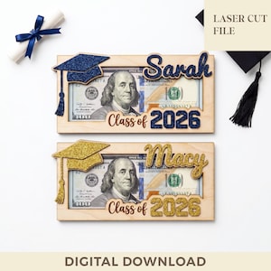 May include: Two wooden graduation frames, each holding a $100 bill. One frame has a blue glitter mortarboard and the name "Sarah", the other has a gold glitter mortarboard and the name "Macy". Both say "Class of 2026".