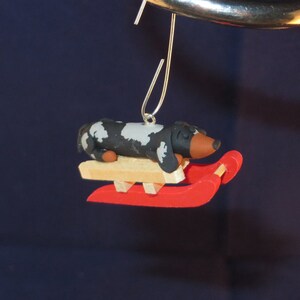 Mini dachshund sled ornament