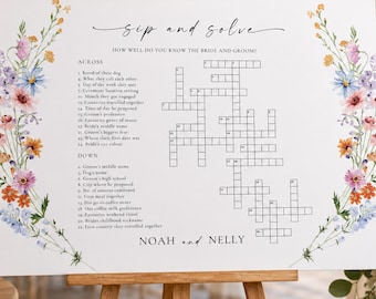 Könnte beinhalten: Ein weißes, rechteckiges Kreuzworträtsel-Schild für Hochzeiten mit dem Titel Sip and Solve, verziert mit Aquarell-Blumenillustrationen in Rosa, Orange und Blau an den Seiten. Das Schild enthält Hinweise für das Brautpaar Noah und Nelly auf einer Staffelei.
