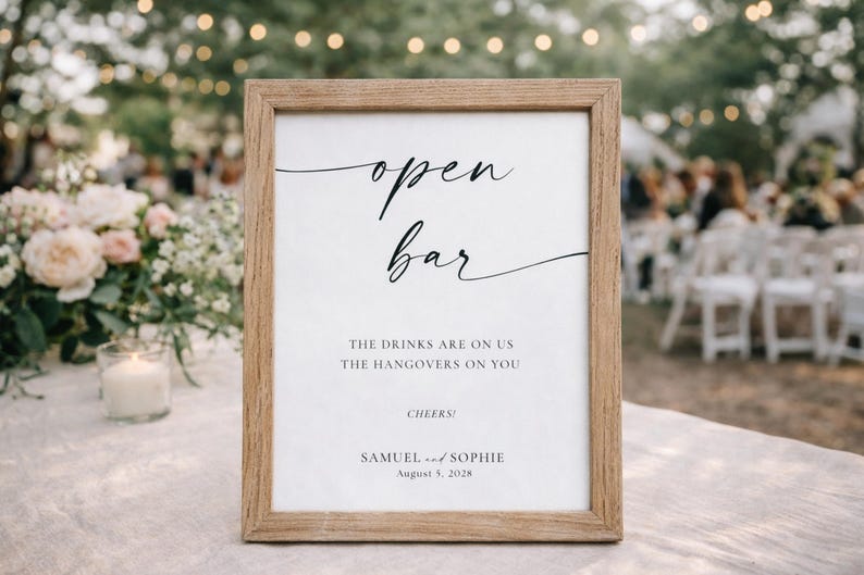 open bar wedding sign in natural wood frame with greenery and outdoor reception background, modern minimalist wedding signage, printable bar sign template, editable Canva wedding decor, garden wedding aesthetic