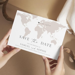 May include: A Save the Date card held by hands, featuring a world map design in neutral tones. The card includes the text "Save the Date" and details for Samuel and Sophie's wedding in London, England.