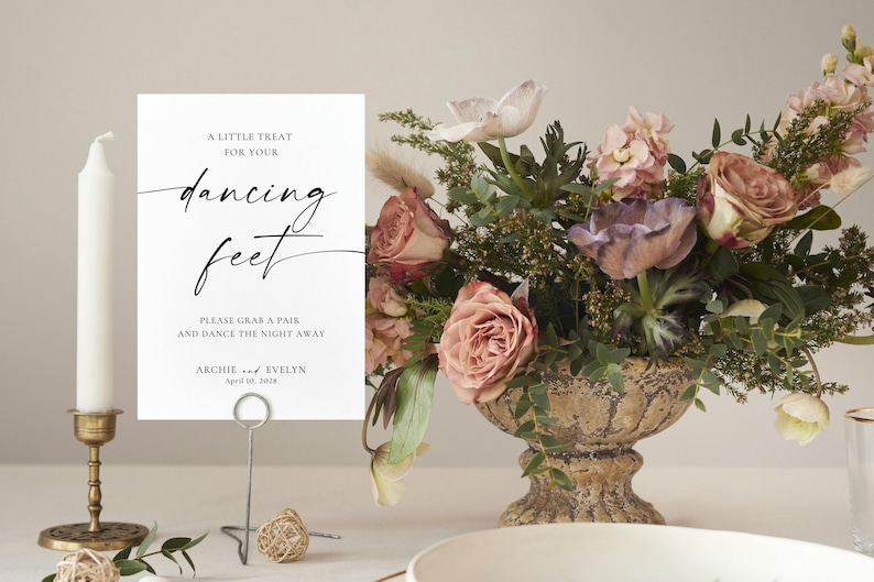 minimalist wedding sign in natural wood frame with blush and peach floral arrangement, elegant wedding table decor, printable wedding signage template, romantic reception styling, soft neutral wedding aesthetic