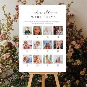 Pode incluir: Uma placa branca em um cavalete com o texto "how old WERE THEY?" e uma série de fotos numeradas de 1 a 12. A placa é cercada por arranjos florais com flores rosa e brancas.