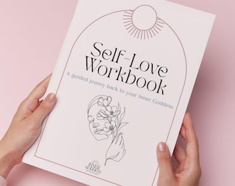 May include: A soft pink workbook titled "Self-Love Workbook" with a line drawing of a face with flowers. The cover also includes the text "A guided journey back to your Inner Goddess". The workbook is held by two hands against a pink background.