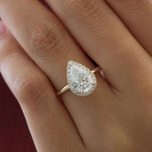 Pear Cut Moissanite Engagement Ring: Hidden Halo, 10k Gold Bridge Solitaire