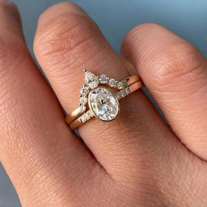 Oval Moissanite Wedding Ring Set: 14K Yellow Gold Bezel Solitaire