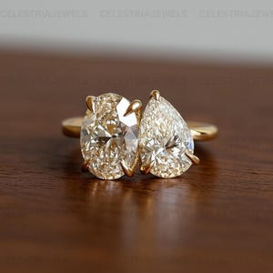 Toi et Moi Moissanite Engagement Ring: Pear & Oval Two Stone, Sterling Silver