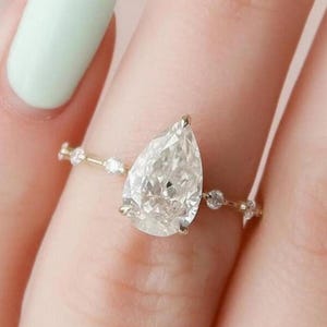 Pear Cut Moissanite Engagement Ring: Hidden Halo, 14K Gold Band
